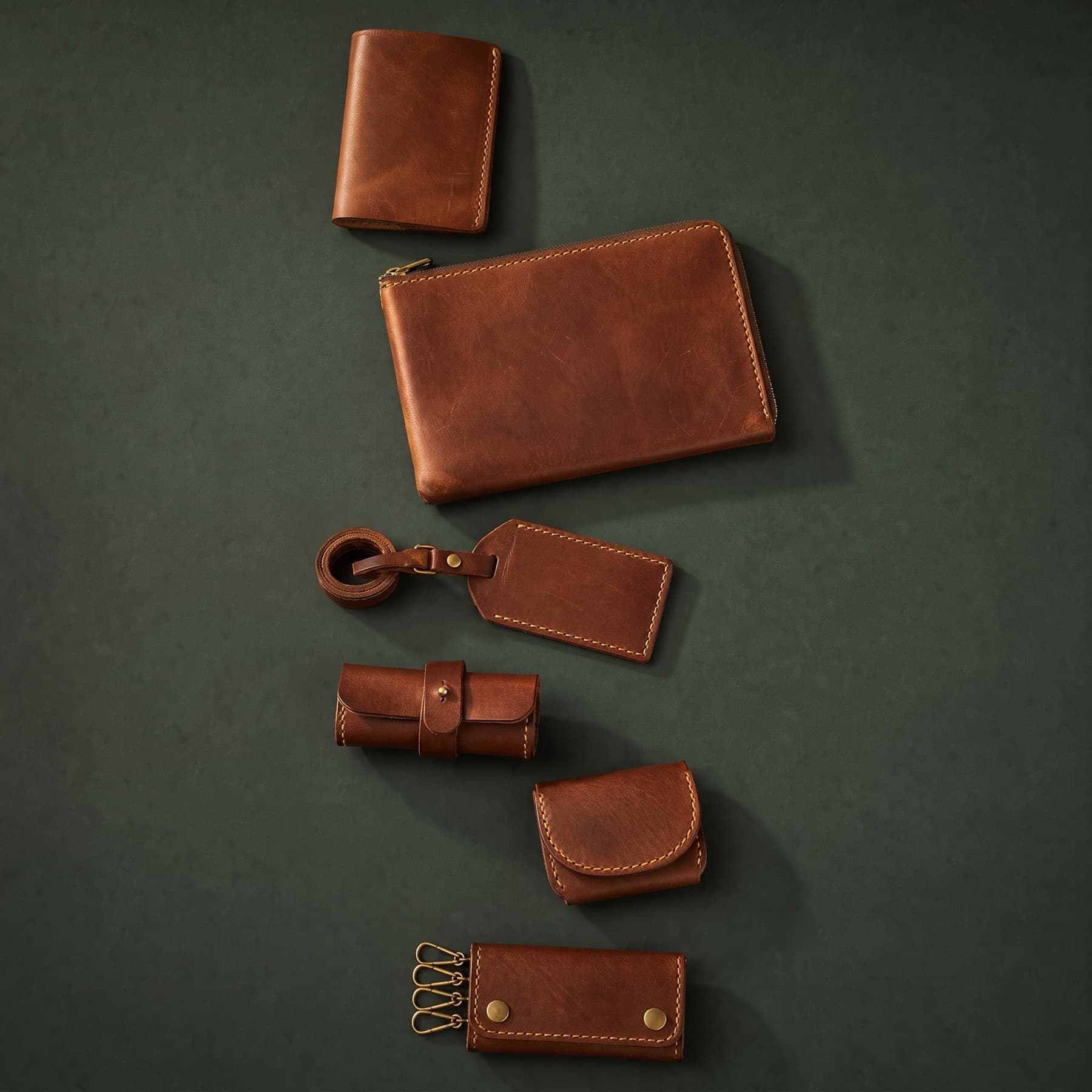 The same six articles after two years of travel, the leather darkened and creased
